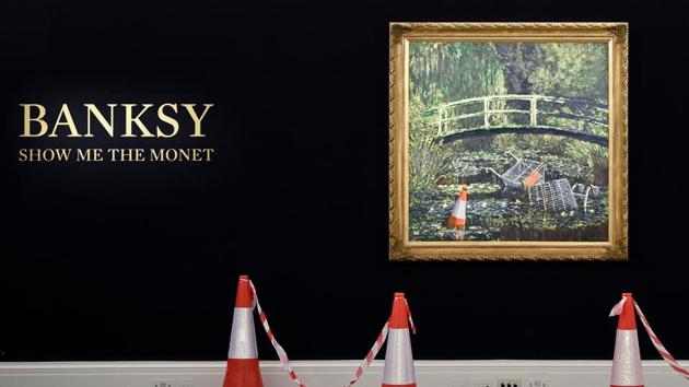 Artwork entitled "Show me the Monet" by the artist Banksy, is pictured during a photocall at Sotheby's auction house in London, ahead of the forthcoming 'Modernites/Contemporary' evening auction set to take place in October.(AFP)