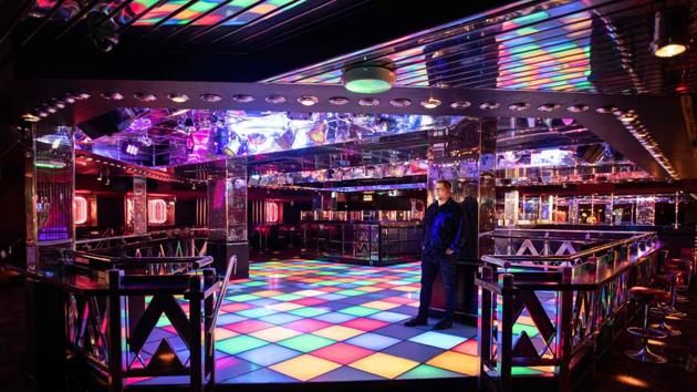 General manager Andy Swinnerton stands inside the dance floor of PRYZM nightclub in Nottingham that remains closed due to ongoing government restrictions in UK to suppress coronavirus. (AFP file) General manager Andy Swinnerton stands inside the dance floor of PRYZM nightclub in Nottingham that remains closed due to ongoing government restrictions in UK to suppress coronavirus. (AFP file)