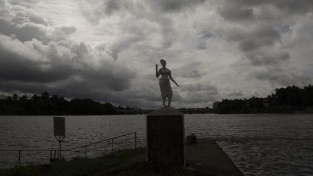 Rain clouds are seen behind a statue on the banks of the Periyar river in Kochi in Kerala.(AP PHOTO.) Rain clouds are seen behind a statue on the banks of the Periyar river in Kochi in Kerala.(AP PHOTO.)