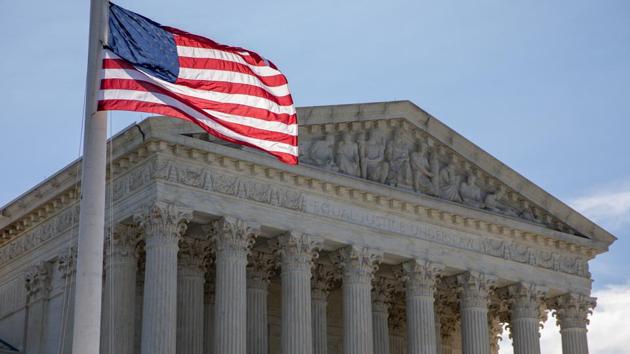 A US flag flies at half-staff during a vigil for Supreme Court Justice Ruth Bader Ginsburg outside the Supreme Court in Washington, DC, on Sept. 19.(Bloomberg) A US flag flies at half-staff during a vigil for Supreme Court Justice Ruth Bader Ginsburg outside the Supreme Court in Washington, DC, on Sept. 19.(Bloomberg)