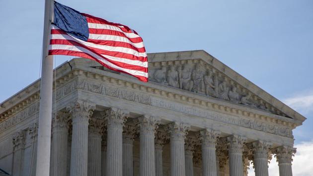 A US flag flies at half-staff during a vigil for Supreme Court Justice Ruth Bader Ginsburg outside the Supreme Court in Washington, DC, on Sept. 19.(Bloomberg)