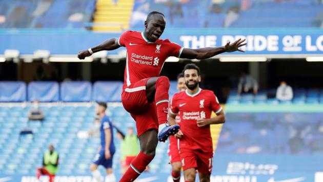 Soccer Football - Premier League - Chelsea v Liverpool - Stamford Bridge, London, Britain - September 20, 2020 Liverpool's Sadio Mane celebrates scoring their second goal with Mohamed Salah Pool via REUTERS/Matt Dunham EDITORIAL USE ONLY. No use with unauthorized audio, video, data, fixture lists, club/league logos or 'live' services. Online in-match use limited to 75 images, no video emulation. No use in betting, games or single club/league/player publications. Please contact your account representative for further details. TPX IMAGES OF THE DAY (Pool via REUTERS)