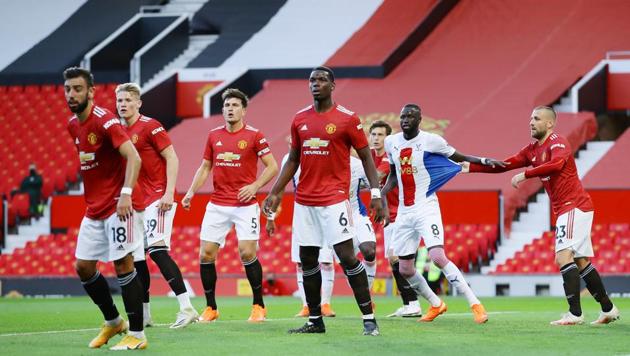 Manchester United's Luke Shaw with Crystal Palace's Cheikhou Kouyate.(Pool via REUTERS)