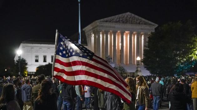 People gather at the Supreme Court in Washington, Saturday night, Sept. 19, 2020, to honor the late Justice Ruth Bader Ginsburg, one of the high court's liberal justices, and a champion of gender equality. (AP photo)