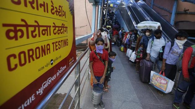 Travellers coming from outside the city queue up for Covid-19 tests at a railway station facility in Ahmedabad on September 18. Health authorities in India have tested a cumulative total of 6,36,61,060 samples so far with 12,06,806 samples being tested on September 19. (Ajit Solanki / AP) Travellers coming from outside the city queue up for Covid-19 tests at a railway station facility in Ahmedabad on September 18. Health authorities in India have tested a cumulative total of 6,36,61,060 samples so far with 12,06,806 samples being tested on September 19. (Ajit Solanki / AP)