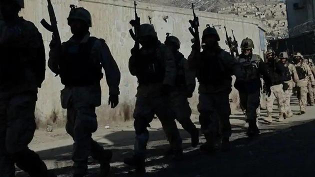 In this file photo, Afghan commandos walk down a road near the Kabul police headquarters.(AFP) In this file photo, Afghan commandos walk down a road near the Kabul police headquarters.(AFP)