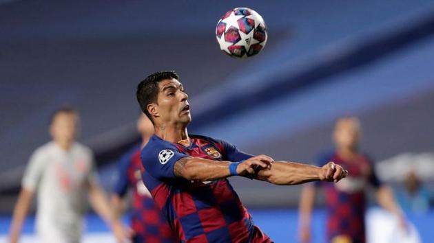 Soccer Football - Champions League - Quarter Final - FC Barcelona v Bayern Munich - Estadio da Luz, Lisbon, Portugal - August 14, 2020 Barcelona's Luis Suarez in action, as play resumes behind closed doors following the outbreak of the coronavirus disease (COVID-19) Manu Fernandez/Pool via REUTERS (REUTERS) Soccer Football - Champions League - Quarter Final - FC Barcelona v Bayern Munich - Estadio da Luz, Lisbon, Portugal - August 14, 2020 Barcelona's Luis Suarez in action, as play resumes behind closed doors following the outbreak of the coronavirus disease (COVID-19) Manu Fernandez/Pool via REUTERS (REUTERS)