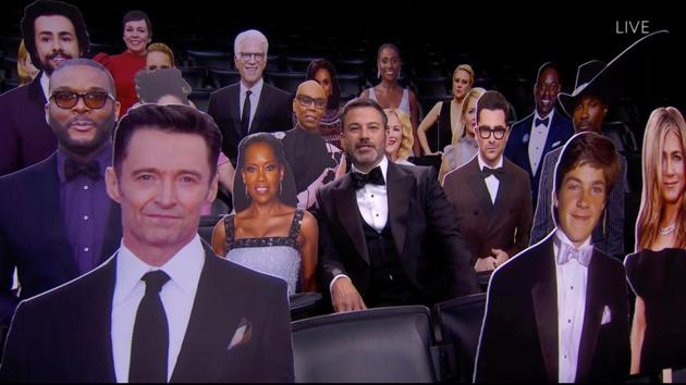 Host Jimmy Kimmel (C) sitting among cutouts of celebrities, similar to the ones being used to fill empty seats at major sporting events, during the 72nd Primetime Emmy Awards ceremony in Los Angeles on September 20. (American Broadcasting Companies, Inc. / ABC / AFP)