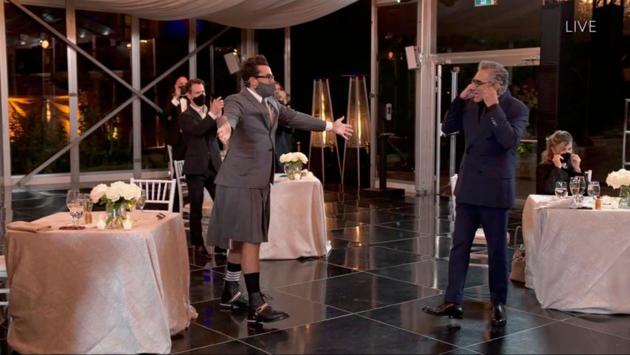 Canadian actor Eugene Levy (R) is greeted by his son Daniel Levy after they and the show ‘Schitt's Creek’ capped their sweep of trophies during the 72nd Primetime Emmy Awards ceremony held virtually on September 20. (Image Group LA / American Broadcasting Companies, Inc. / ABC / AFP)
