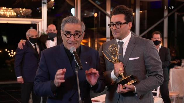 Eugene Levy (L), and Daniel Levy from ‘Schitt's Creek’ accept the Emmy for Outstanding Comedy Series during the 72nd Emmy Awards. This was one of nine Emmy wins for the show in this year’s ceremony and a record for most wins in a single season for a comedy. (Invision for the Television Academy / AP)
