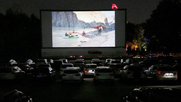 People sit in cars for an outdoor movie projection during Beijing International Film Festival at the Maple Garden Drive-in Cinema, following the coronavirus disease (Covid-19) outbreak in Beijing, China on August 24, 2020. (Reuters File Photo/Representative Image) People sit in cars for an outdoor movie projection during Beijing International Film Festival at the Maple Garden Drive-in Cinema, following the coronavirus disease (Covid-19) outbreak in Beijing, China on August 24, 2020. (Reuters File Photo/Representative Image)