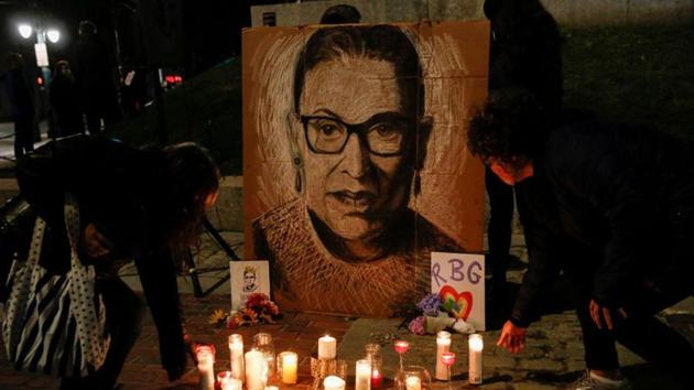 The late US Supreme Court Justice Ruth Bader Ginsburg is mourned during a vigil in Monument Square in Portland, Maine.(REUTERS) The late US Supreme Court Justice Ruth Bader Ginsburg is mourned during a vigil in Monument Square in Portland, Maine.(REUTERS)