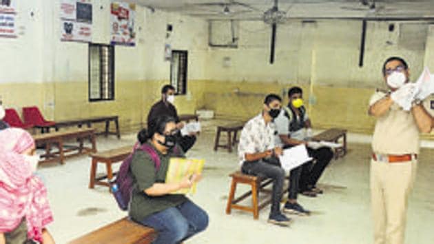 People wait to give their Learner's license Test as the RTO opens after the lockdown in Pune.(Shankar Narayan/HT PHOTO)