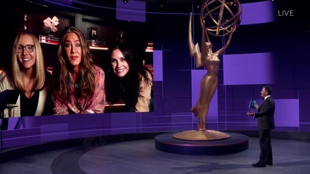 Jimmy Kimmel (R), speaks with Lisa Kudrow, Jennifer Aniston and Courteney Cox during the 72nd Emmy Awards telecast on September 20. (Invision for the Television Academy / AP)