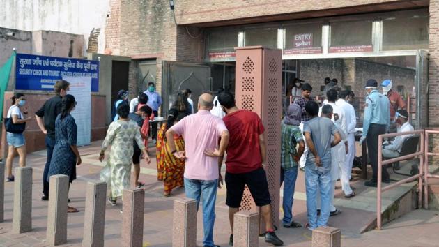 Tourists stand in a queue to buy tickets at the Taj Mahal in Agra on September 21. The authorities have capped the visitors’ number at 5,000 which was an average of 20,000 before coronavirus hit the country. According to Reuters’ report, tickets are only being sold online and fewer than 300 tickets were sold on the first day.  (ANI) 
