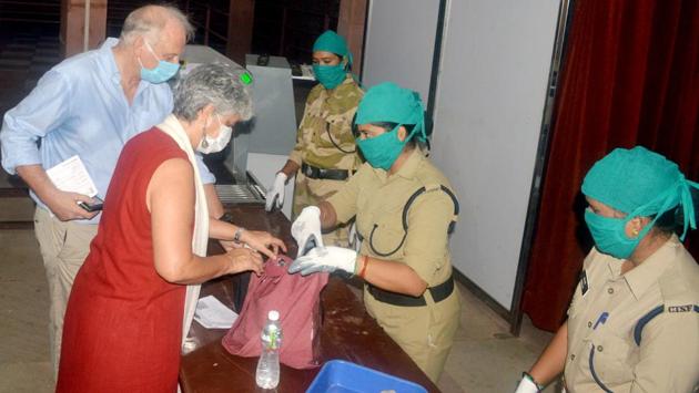 Women security personnel check the bags of tourists before entering the Taj Mahal after it reopened for public in Agra on September 21. Since India has not yet opened its doors to international tourists, only a few foreign nationals  (some of whom were already living in the country) came to visit the monument.  (ANI) 