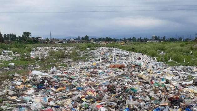 Solid waste dumped near a river and forest site in Uttarakhand.(HT File)