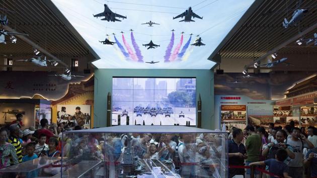 Chinese Air Force received flak in social media for using clips from Hollywood movies in the promotional video for the Chinese Air Force. In this file photo, visitors look at a scale model of a Chinese aircraft carrier during an exhibition to mark the 90th anniversary of the founding of the People's Liberation Army at the military museum in Beijing. (AP) Chinese Air Force received flak in social media for using clips from Hollywood movies in the promotional video for the Chinese Air Force. In this file photo, visitors look at a scale model of a Chinese aircraft carrier during an exhibition to mark the 90th anniversary of the founding of the People's Liberation Army at the military museum in Beijing. (AP)