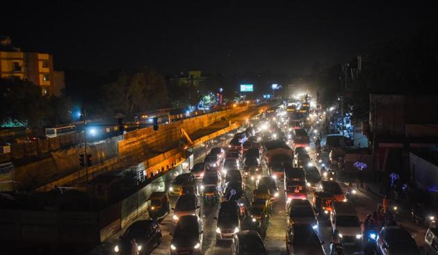 An aerial view showing slow moving traffic past a construction site, at Ashram , in New Delhi(Amal KS/HT PHOTO)