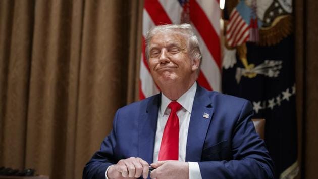 President Donald Trump prepares to sign an Executive Order on hiring American workers, in the Cabinet Room of the White House, on August 3.(AP File)