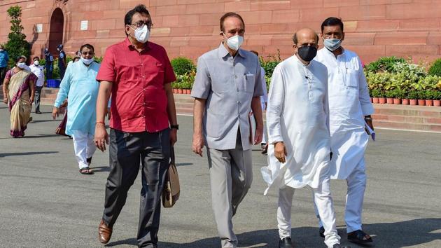 Congress MP Ghulam Nabi Azad, Trinamool Congress MP Dinesh Trivedi and other Opposition MPs stage a walkout from Rajya Sabha, demanding the suspension of eight lawmakers be revoked in New Delhi on Tuesday.(PTI)