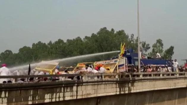 In Haryana’s Ambala, the police used water cannon against Lok Insaaf Party workers, who were taking out a bike rally from Punjab to Delhi to protest against the farm reform bills. (ANI photo)