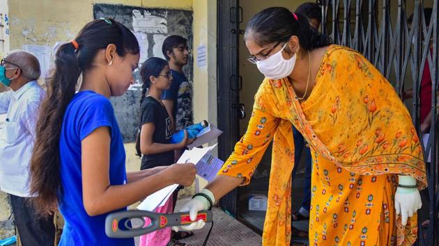 Students undergo checking in front of an examination centre in Rajasthan. (File photo: PTI) (PTI) Students undergo checking in front of an examination centre in Rajasthan. (File photo: PTI) (PTI)