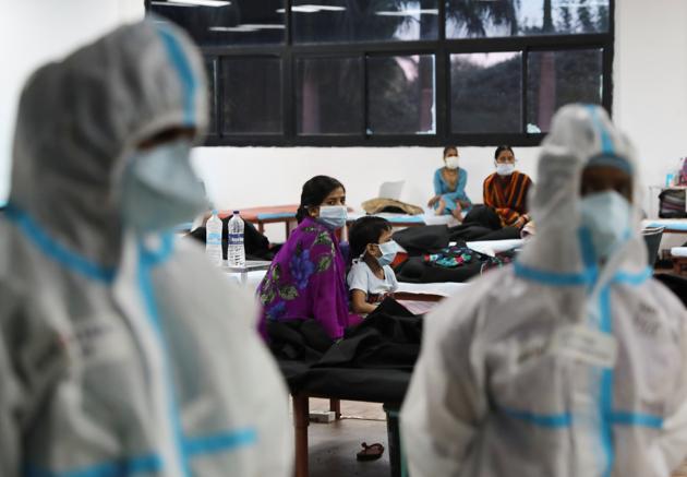 A woman sits with her child inside a quarantine centre for the coronavirus disease (Covid-19) patients amidst the spread of the disease at an indoor sports complex in New Delhi (REUTERS/Anushree Fadnavis) A woman sits with her child inside a quarantine centre for the coronavirus disease (Covid-19) patients amidst the spread of the disease at an indoor sports complex in New Delhi (REUTERS/Anushree Fadnavis)