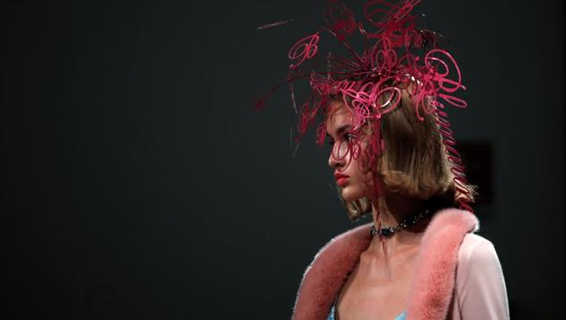 A model presents a creation during fashion week in Milan, Italy, September 23, 2020.(REUTERS)