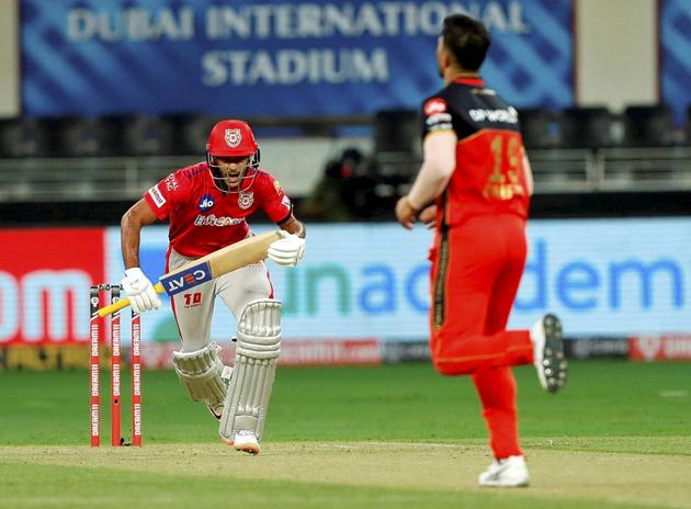 Kings XI Punjab batsman Mayank Agarwal runs between the wickets during IPL 2020 cricket match against Royal Challengers Bangalore, at Dubai International Cricket Stadium in Dubai, Thursday, Sept. 24, 2020. (PTI Photo/Sportzpics)(PTI24-09-2020_000190B) (PTI)