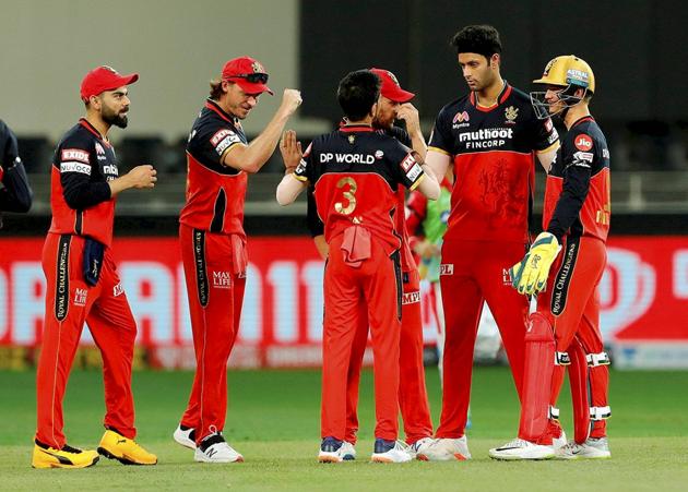 Royal Challengers Bangalore (RCB) players celebrate the wicket of Kings XI Punjab batsman Mayank Agarwal during IPL 2020 cricket match against RCB, at Dubai International Cricket Stadium in Dubai, Thursday, Sept. 24, 2020. (PTI Photo/Sportzpics)(PTI24-09-2020_000199A) (PTI)