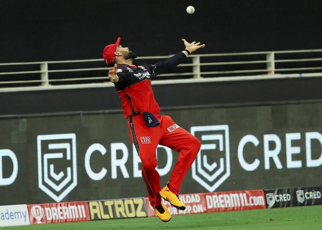 Royal Challengers Bangalore (RCB) captain Virat Kohli attempts to catch the ball during IPL 2020 cricket match against Kings XI Punjab, at Dubai International Cricket Stadium in Dubai, Thursday, Sept. 24, 2020. (PTI Photo/Sportzpics)(PTI24-09-2020_000222A) (PTI)