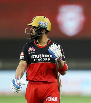 Royal Challengers Bangalore (RCB) skipper Virat Kohli walks towards the pavillion after being dismissed during IPL 2020 cricket match against Kings XI Punjab, at Dubai International Cricket Stadium in Dubai, Thursday, Sept. 24, 2020. (PTI Photo/Sportzpics)(PTI24-09-2020_000225B) (PTI)