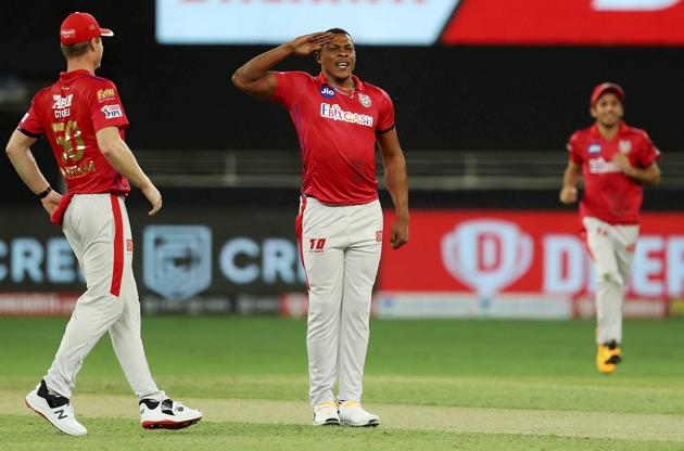 Kings XI Punjab bowler Sheldon Cottrell performs a salute after dismissing Royal Challengers Bangalore (RCB) batsman Devdutt Padikkal during IPL 2020 cricket match, at Dubai International Cricket Stadium in Dubai, Thursday, Sept. 24, 2020. (PTI Photo/Sportzpics)(PTI24-09-2020_000229B) (PTI)