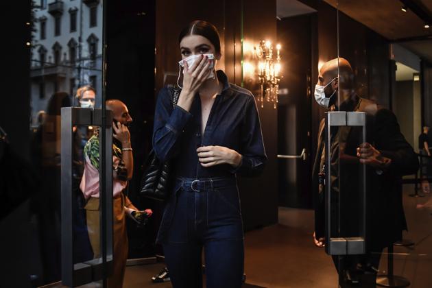 Guests and models depart after the Dolce & Gabbana fashion show during Milan's fashion week in Milan, Italy, Wednesday, Sept. 23, 2020.  (AP) 