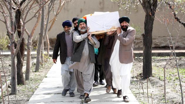 Afghan Sikh men carry a coffin of one of the victims who was killed in an attack on a gurdwara in Kabul in March 26.(REUTERS FILE PHOTO)