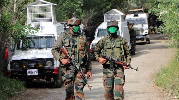 Army jawans walk towards an encounter site. (ANI Photo) Army jawans walk towards an encounter site. (ANI Photo)