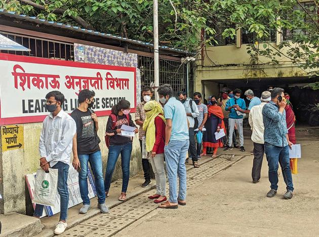 People queue up for application of Learning license at RTO in Pune on Thursday.(Shankar Narayan/HT PHOTO)