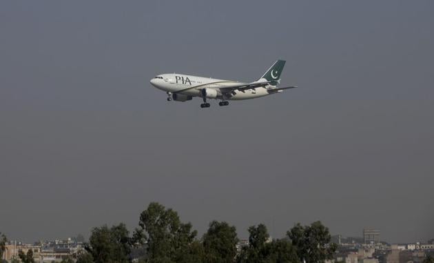 FILE PHOTO: A Pakistan International Airlines (PIA) passenger plane arrives at the Benazir International airport in Islamabad, Pakistan, December 2, 2015. REUTERS/Faisal Mahmood/File Photo