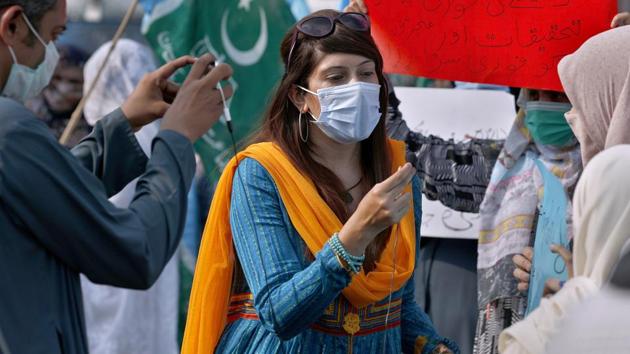 In this September 11, 2020 photo, Mona Khan, a freelance journalist, interviews during a rally in Islamabad, Pakistan. In recent weeks, social media attacks against Pakistan's women journalists have been vile, prompting the Committee to Protect Journalists to issue a statement on September 18, condemning the relentless attacks.(AP/ FILE) In this September 11, 2020 photo, Mona Khan, a freelance journalist, interviews during a rally in Islamabad, Pakistan. In recent weeks, social media attacks against Pakistan's women journalists have been vile, prompting the Committee to Protect Journalists to issue a statement on September 18, condemning the relentless attacks.(AP/ FILE)