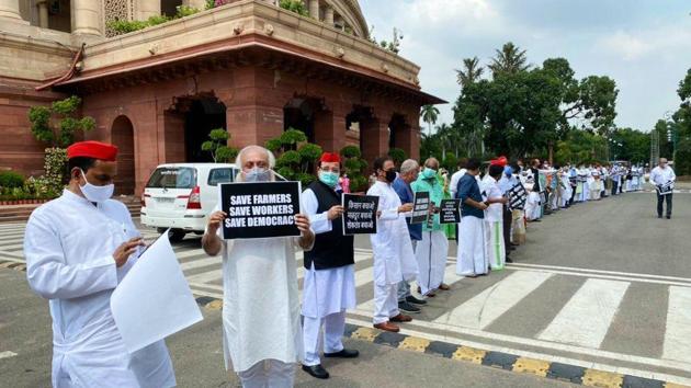 Opposition parties stage a protest over the farm bills at Parliament House in New Delhi on September 23. The Farmers’ Produce Trade and Commerce (Promotion and Facilitation) Bill, 2020 and the Farmers (Empowerment and Protection) Agreement of Price Assurance and Farm Services Bill, 2020 were passed through a voice vote amid opposition protests in Rajya Sabha on September 20. Opposition members alleged that their demand for a division of votes was rejected. (HT Photo) Opposition parties stage a protest over the farm bills at Parliament House in New Delhi on September 23. The Farmers’ Produce Trade and Commerce (Promotion and Facilitation) Bill, 2020 and the Farmers (Empowerment and Protection) Agreement of Price Assurance and Farm Services Bill, 2020 were passed through a voice vote amid opposition protests in Rajya Sabha on September 20. Opposition members alleged that their demand for a division of votes was rejected. (HT Photo)
