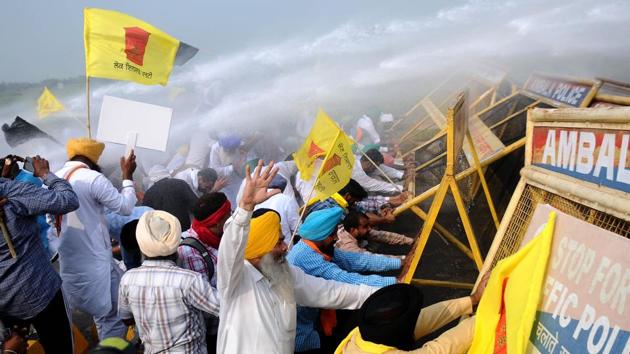 Lok Insaf Party workers are sprayed with water cannons by Haryana Police during a protest against the central government at the Punjab -Haryana border in Patiala on September 23. The Rajya Sabha has passed the Essential Commodities (Amendment) Bill, 2020, the Farmers’ Produce Trade and Commerce (Promotion and Facilitation) Bill, 2020 and the Farmers (Empowerment and Protection) Agreement of Price Assurance and Farm Services Bill, 2020, during the monsoon session of the parliament. (Bharat Bhushan / HT Photo) Lok Insaf Party workers are sprayed with water cannons by Haryana Police during a protest against the central government at the Punjab -Haryana border in Patiala on September 23. The Rajya Sabha has passed the Essential Commodities (Amendment) Bill, 2020, the Farmers’ Produce Trade and Commerce (Promotion and Facilitation) Bill, 2020 and the Farmers (Empowerment and Protection) Agreement of Price Assurance and Farm Services Bill, 2020, during the monsoon session of the parliament. (Bharat Bhushan / HT Photo)