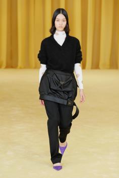 A model presents a creation from the Prada Spring/Summer 2021 women's collection during fashion week in Milan, Italy, in this handout photo released on September 24, 2020. The creations were presented in a short film of models walking through a canary yellow draped and carpeted space, past a myriad of movie cameras. (via REUTERS) A model presents a creation from the Prada Spring/Summer 2021 women's collection during fashion week in Milan, Italy, in this handout photo released on September 24, 2020. The creations were presented in a short film of models walking through a canary yellow draped and carpeted space, past a myriad of movie cameras. (via REUTERS)