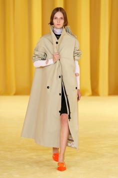 Models clutched wraps at their chests, a protective image symbolic of the global hunkering down during the coronavirus pandemic. A model presents a creation from the Prada Spring/Summer 2021 women's collection during fashion week in Milan, Italy, in this handout photo released on September 24, 2020. (via REUTERS) Models clutched wraps at their chests, a protective image symbolic of the global hunkering down during the coronavirus pandemic. A model presents a creation from the Prada Spring/Summer 2021 women's collection during fashion week in Milan, Italy, in this handout photo released on September 24, 2020. (via REUTERS)