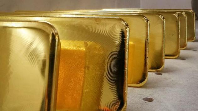 Newly-casted ingots of 99.99% pure gold are stored after weighing at the Krastsvetmet non-ferrous metals in the Siberian city of Krasnoyarsk in Russia in this file photo.(Reuters Photo)