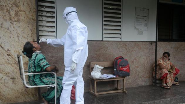A health worker takes a throat swab during Covid-19 screening in Mumbai on September 25. The city reported 2,163 cases taking the tally to 192,427 and 54 deaths taking the toll to 8,658 on September 24. A total of 155,638 patients have recovered. The city has 27,741 active cases of coronavirus infection. (Indranil Mukherjee / AFP) A health worker takes a throat swab during Covid-19 screening in Mumbai on September 25. The city reported 2,163 cases taking the tally to 192,427 and 54 deaths taking the toll to 8,658 on September 24. A total of 155,638 patients have recovered. The city has 27,741 active cases of coronavirus infection. (Indranil Mukherjee / AFP)