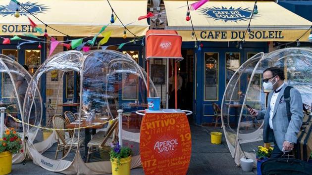 Bubble tents are set up outside Cafe Du Soliel following the outbreak of the coronavirus disease.(REUTERS)