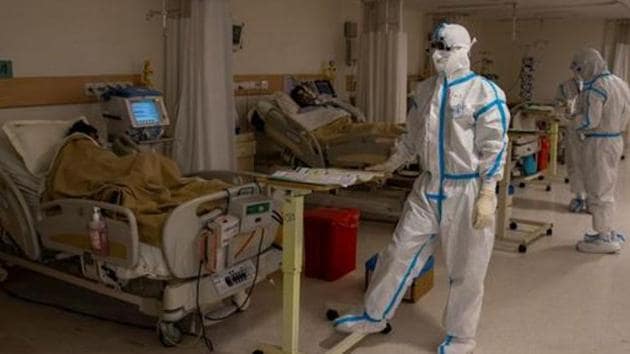 Medical workers take care of patients suffering from the coronavirus disease (Covid-19), at the Intensive Care Unit (ICU) of the Max Smart Super Speciality Hospital in New Delhi.(Reuters) Medical workers take care of patients suffering from the coronavirus disease (Covid-19), at the Intensive Care Unit (ICU) of the Max Smart Super Speciality Hospital in New Delhi.(Reuters)