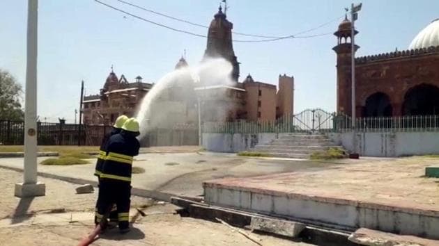 Sanitisation being carried out by municipal corporation workers around the Shri Krishna Janmasthan Temple and Shahi Idgah complexes in Mathura.(ANI File)