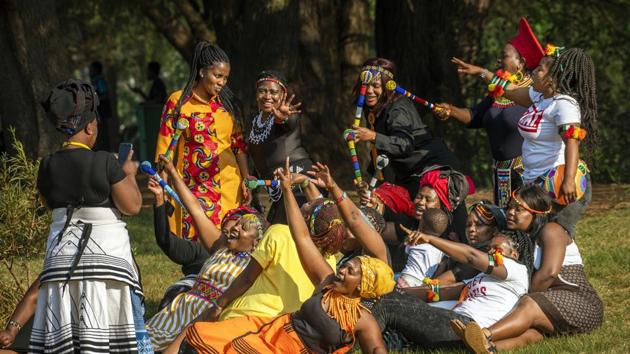 A group of women dressed in traditional clothing pose for a selfie as they celebrate South Africa's Heritage Day at Zoo Lake park in Johannesburg.(AP) A group of women dressed in traditional clothing pose for a selfie as they celebrate South Africa's Heritage Day at Zoo Lake park in Johannesburg.(AP)